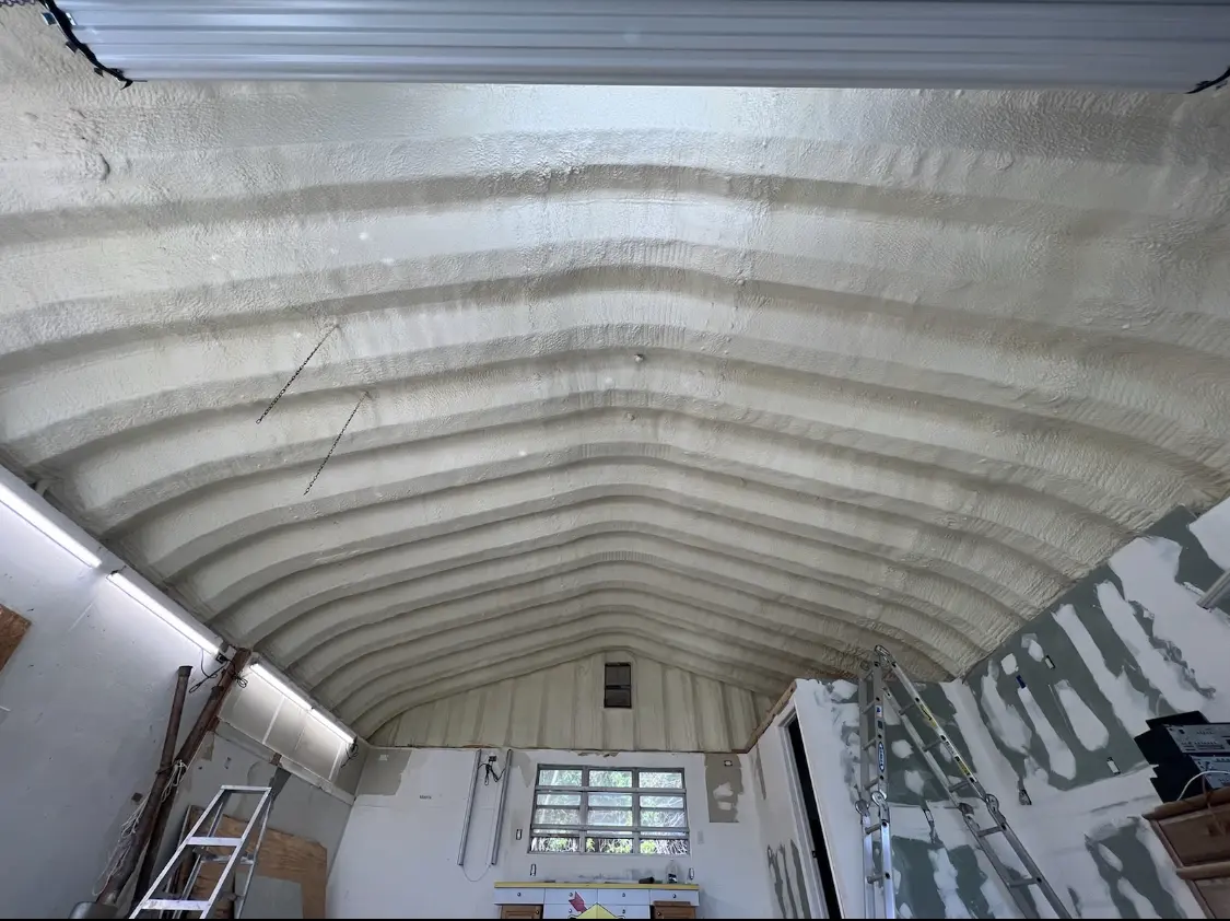 Spray polyurethane foam applied to the underside of a metal roof deck in Halawa